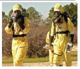 Two responders in hazard suits