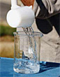 water being poured into a beaker