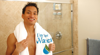 A man dries off after a water–efficient shower as part of the We're Here For Water campaign.