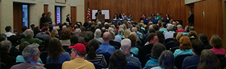 Image of people attending a public meeting