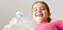 Photo of a student at school recycling