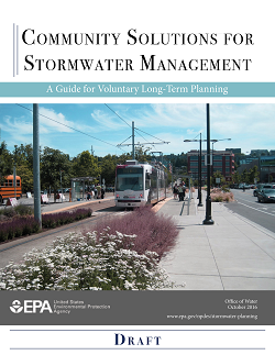 This is a decorative photo showing thumbnail image of the front page of the draft guide with a photo of green infrastructure around people at a light rail station.