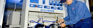 image of man scientist in blue using machine to test water samples
