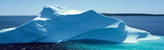 An iceburg floating in the ocean