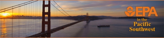 Image of the Golden Gate Bridge at sunrise with a ship passing beneath