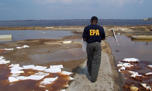 EPA Employee in the field after Hurricane Katrina inspecting debris.