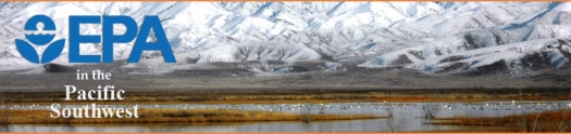 Panorama of snow covered mountains in background with wetlands and mirgratory birds