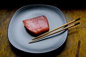 Photo of salmon with chopsticks