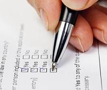 Image showing someone using a pen to cross items off of a checklist