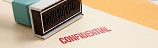 Image of the word confindential stamped on a page