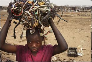 E-Waste in Africa boy carrying electrical wires