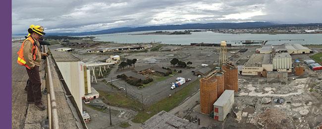 Inspectors on rooftop overlooking the abandoned Samoa Pulp Mill on Humboldt Bay near Eureka, Calif.