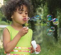 Girl blowing bubbles