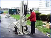 Photo of scientist using direct push sampler.