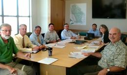 Municipal staff sitting around a meeting table