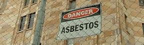 "Danger: Asbestos" sign on building