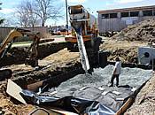 Gravel Being Poured into Barnstable BMP on top of Geotextile Lining [04/29/2015]