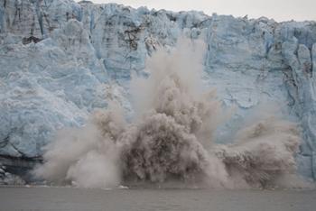 Image of a glacier calving. Click to learn about how rates of climate change have varied over time.