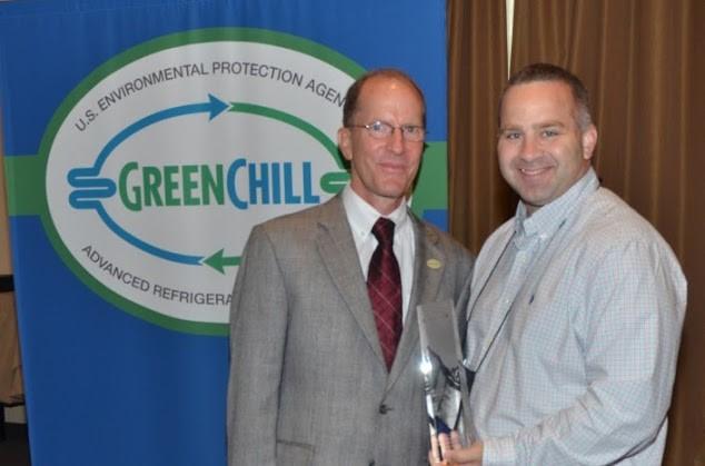 Brad Morris of Giant Eagle accepts the Best Emissions Rate award from Tom Land of the EPA GreenChill Program.