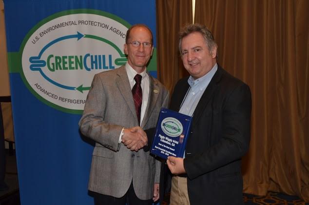 Keith Milligan of Piggly Wiggly accepts the Best of the Best award for the store in Columbus, GA from Tom Land of the EPA GreenChill Program.