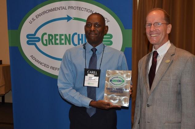 Kenneth Jackson on behalf of Stater Bros. Markets accepts one of four Store Re-Certification Excellence awards from Tom Land of the EPA GreenChill Program.