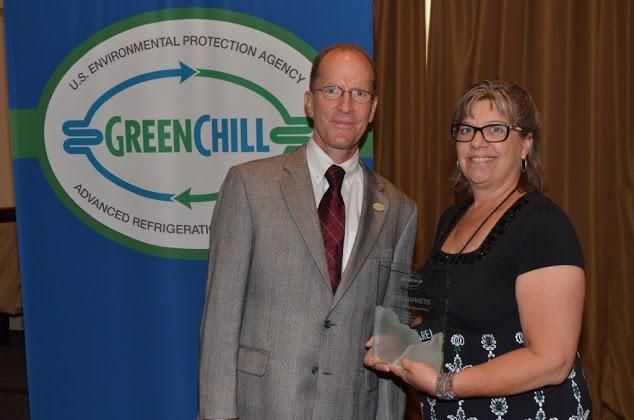 Patti Olenick of Weis Markets accepts the Most Improved Emissions Rate, Superior Goal Achievement, and Store Re-Certification Excellence awards from Tom Land of the EPA GreenChill Program.