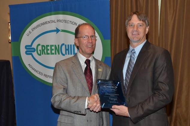 Paul Anderson of Target accepts the Distinguished Partner award from Tom Land of the EPA GreenChill Program.