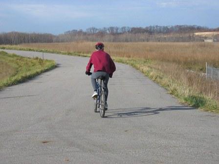 A bicyclist on the bike trail at the site