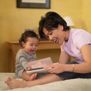 lady with baby and book