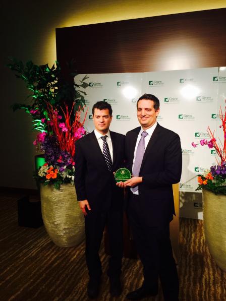Jared Blumenfeld presents Chris Brophy, VP of Sustainability at MGM Resorts, with two national food recovery awards.