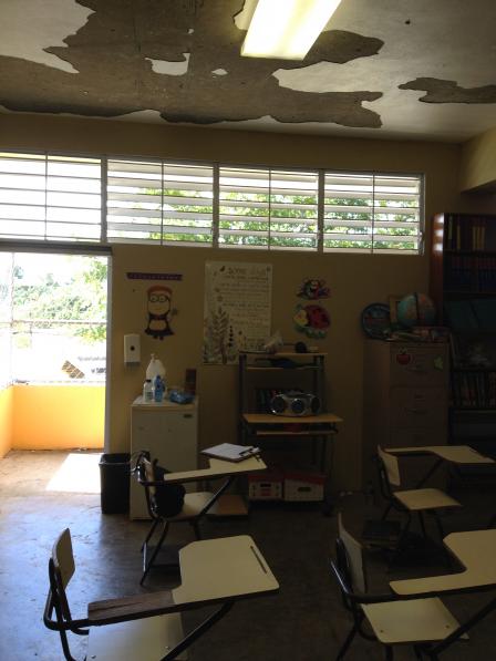 photo of classroom with peeling paint on the ceiling