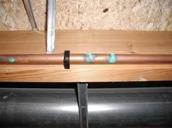 A copper pipe with leaks