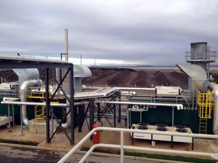 Zero Waste Energy Industrial  Facility with hills of compost beyond