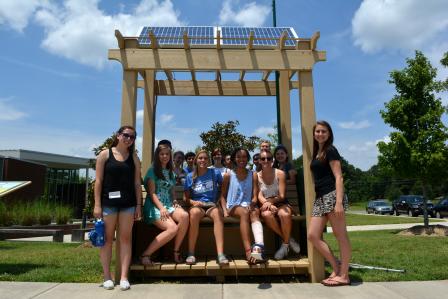 Photo of students visiting the Village Green bench in Durham.