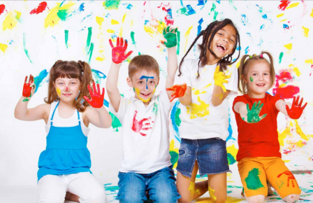 children playing with multiple colors of paint.