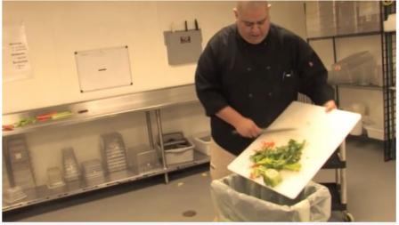Man putting food scraps into a bin destined for composting