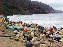 Plastic and other garbage on a beach.