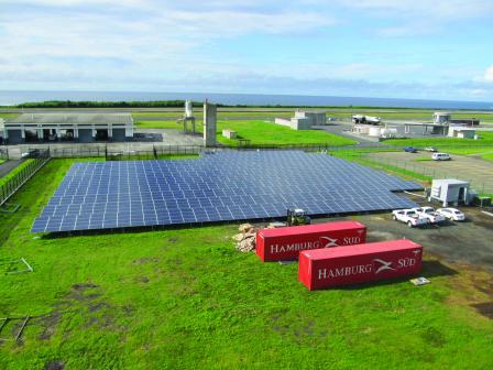 Solar panels in a green field