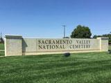 Sacramento Valley National Cemetery entrance sign on grass lawn