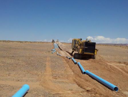 Pipes laid out across land to be used to transport water