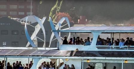 Close up of Alcatraz Ferry showing solar panels and wind generators