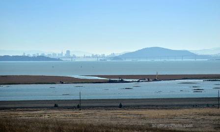 Sears Point Post Levee Breach view from a distance of the work area, now flooded wetlands, with the Richmond Bridge and San Francisco in the distance.