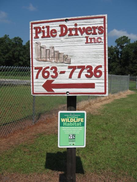 Sign at entrance of Pile Drivers. The small green sign indicates that the area is a Certified Wildlife Habitat