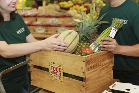 Image depicting Shoppers filling up a box of produce at Sprouts Market