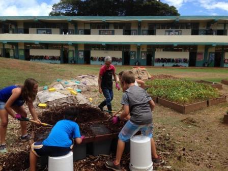 this is an image of students working in the garden