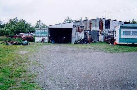 A photograph of Pinette's vehicle salvage yard garage