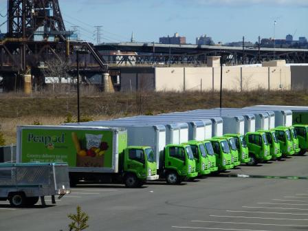 Peapod delivery trucks parked on site