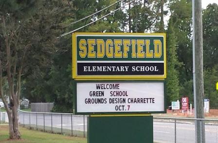 Sign announces special forum – the Green School Grounds Design Charrette.