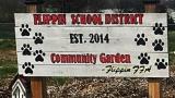 Flippin, AR, community garden sign