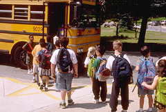 school children boarding clean school bus